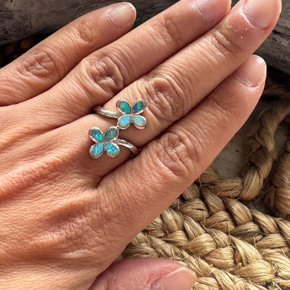 sterling silver plumeria flower ring with blue opal inlay.